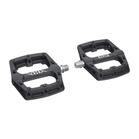 Retox Platform Bicycle Pedals (Origin8), a pair of black thermoplastic pedals with silver screws, 18 mm thick, featuring reflectors, suitable for various bicycle brands and models.