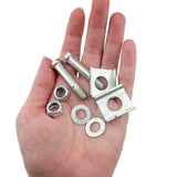 A hand holding metal bolts, nuts, and washers, showcasing the components of the Training Wheels with Brackets & Hardware (Set of 2) for easy bike installation.