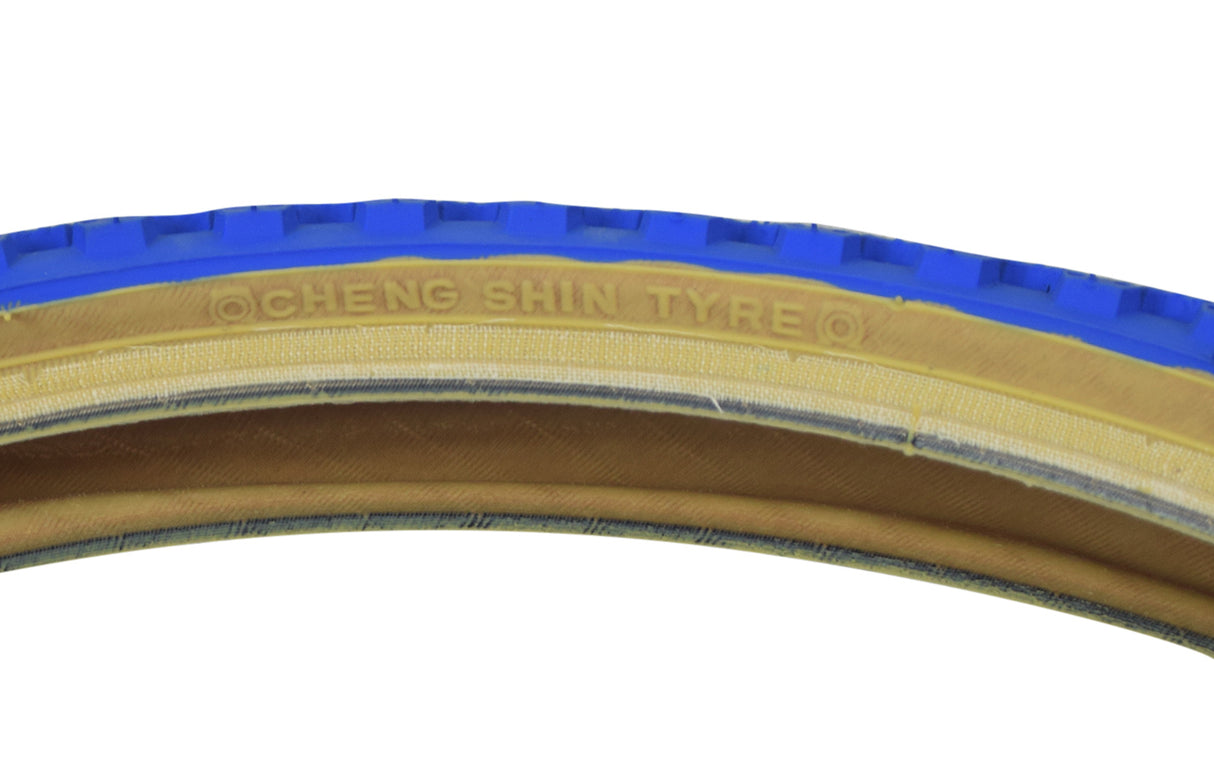 Close-up of the 20x1.75 Blue MX3/C714 Bicycle Tire showcasing its classic knobby BMX tread and skin sidewalls.