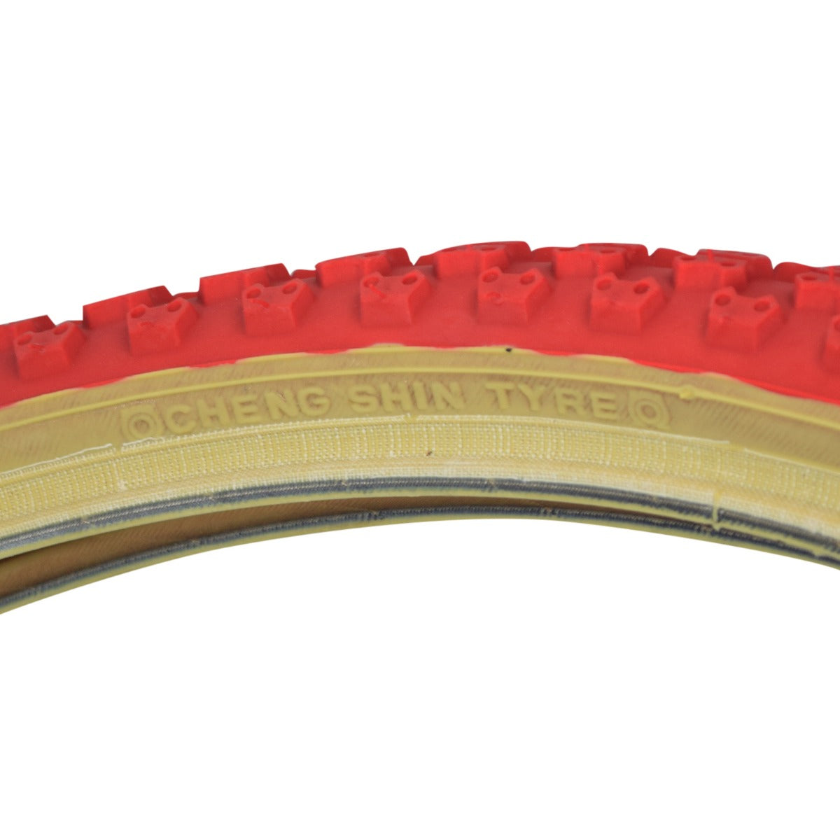 20x1.75 Red MX3/C714 Bicycle Tire, featuring a classic knobby BMX tread with skin sidewalls, focusing on a close-up of the tire's detailed surface pattern.