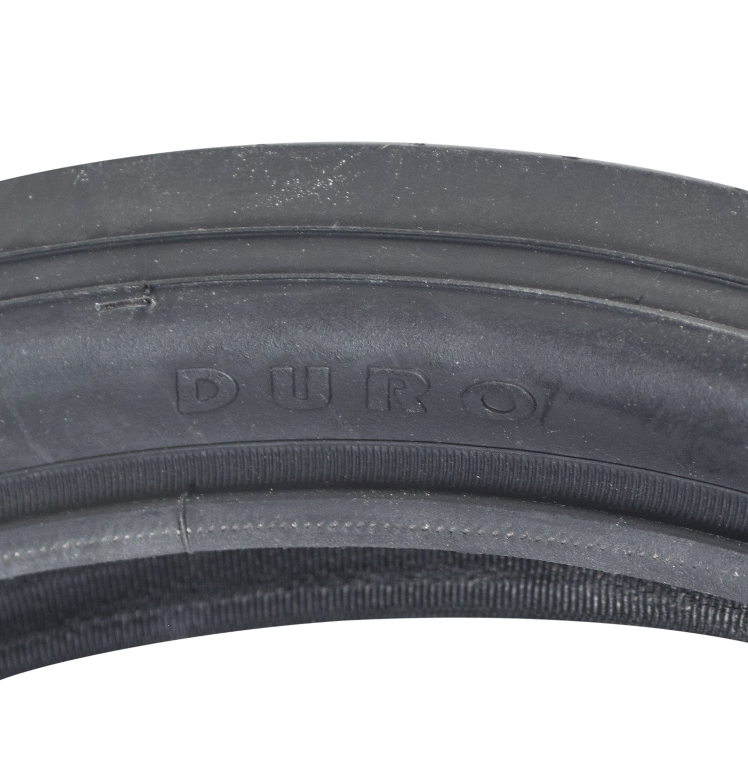 20x2.125 Black/Black Classic Slick Bicycle Tire close-up showing slick center tread and continuous curved lines, ideal for Schwinn Stingray and BMX bikes with retro aesthetics.