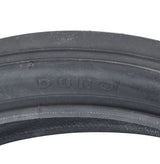 20x2.125 Black/Black Classic Slick Bicycle Tire close-up showing slick center tread and continuous curved lines, ideal for Schwinn Stingray and BMX bikes with retro aesthetics.