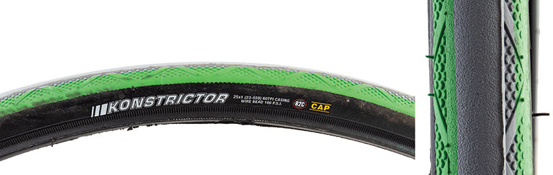 Close-up of the 25x1 Kenda Konstrictor Tire for Sport Wheelchairs, showcasing its distinctive black and green two-tone design with smooth center tread and micro knobs on the shoulders.