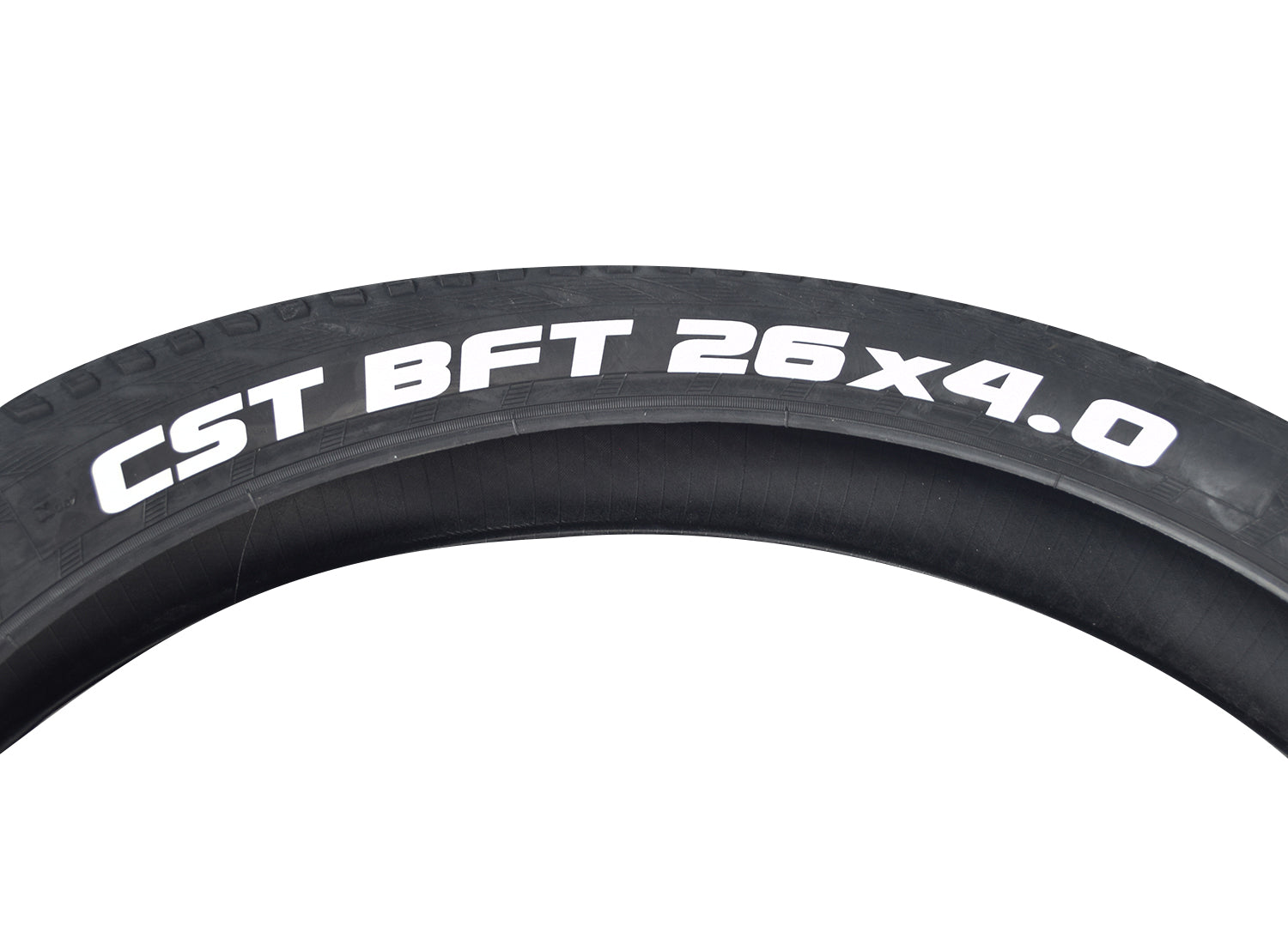 26x4.0 CST BFT Knobby Fat Bike Tire featuring a wide, low-pressure design with a directional tread pattern, ideal for dirt trails, mud, snow, and sand, ensuring minimal trail damage.