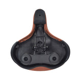 Cloud-9 Support XL Saddle Seat (Brown) with black elastomer springs and multi-stage foam padding, designed for comfort and water resistance, shown in a close-up view highlighting its smooth upholstery and supportive structure.