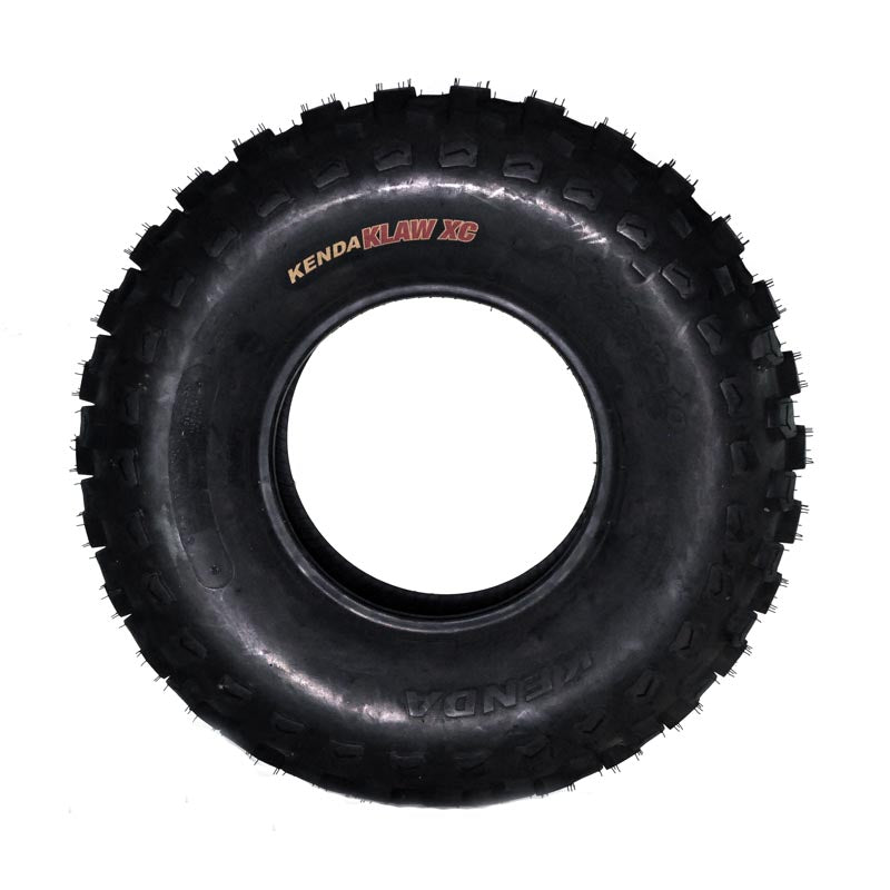 Kenda 23x7.00-10 K532 Klaw XC ATV tire with visible tread pattern and central hole, designed for durability with a 6-ply-rated outer casing for puncture resistance. Suitable for cross-country terrain and short course racing.