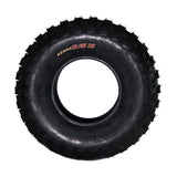 Kenda 23x7.00-10 K532 Klaw XC ATV tire with visible tread pattern and central hole, designed for durability with a 6-ply-rated outer casing for puncture resistance. Suitable for cross-country terrain and short course racing.