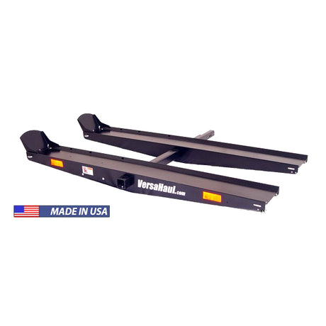 Lawn and Garden Carrier: A black metal carrier with adjustable rails and anti-tilt bracket, designed for transporting heavy lawn and garden equipment, fitting standard Class III or IV trailer hitches.