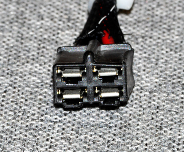 Close-up of the Left Drive Motor Assembly for the Jazzy 1170XL, featuring a black and red electrical plug and connector components.