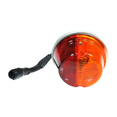 Left Rear Lighting Assembly for Pride Legend XL (SC3450) featuring close-up view of light, black cable, and electronic harness, including orange and red lens cover.