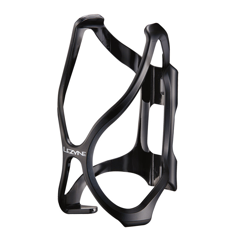 Lezyne Flow Bottle Cage, a black bicycle water bottle holder with an X-Grip design and dual upper grips, made from durable, lightweight fiber reinforced Composite Matrix material with a wide front opening for easy bottle access.