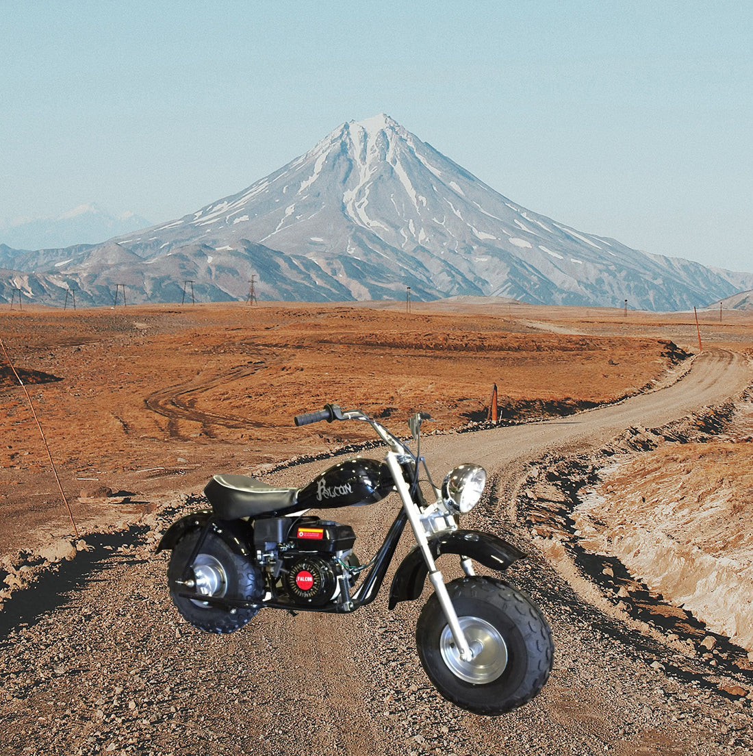 Black Seat for Baja Mini Bike MB165 & MB200 (Baja Heat, Mini Baja, Baja Warrior) (Blemished) shown on a black and white motorcycle parked on a desert dirt road with mountainous background.