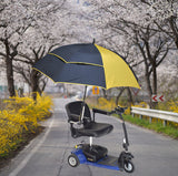 Universal Grip Umbrella Holder for Mobility Scooters, Power Chairs, & Wheelchairs, shown mounted on a scooter on a road, featuring an adjustable stem and flexible arm for optimal positioning.