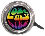 Close-up of a Swell Bell Chrome Bicycle & Scooter Bell, showcasing its durable metal base and thumb lever, with a colorful logo design visible on the bell's surface.