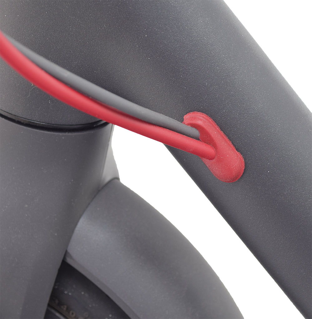 Close-up of the Red Wire Grommet Set for the Xiaomi Mi M365, showing red silicone plugs that secure wires and brake cable, preventing dust and moisture from entering the handlebar frame and battery tray.