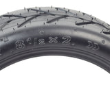 Close-up of an 8-1/2 x 2 pneumatic tire with directional tread for Hiboy® S2 & S2R electric scooters, highlighting its shallow groove design for smoother rides on hard pavement.