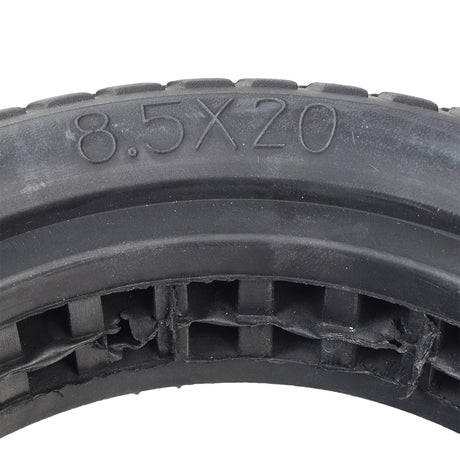 Close-up of the 8-1/2x 2 Shock Absorber Solid Tire for the AOVOPRO ES80 350W Electric Scooter, highlighting its intricate tread pattern and durable rubber material.