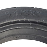 8-1/2x 2 Solid Tire for the Xiaomi Mi M365 electric scooter, black with visible tread pattern, showcasing durable, puncture-proof solid rubber construction suitable for Xiaomi Mi M365 and similar rental scooters.