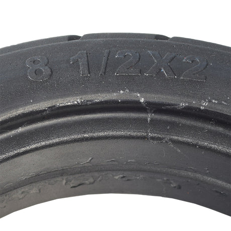 8-1/2x 2 Solid Tire for the Xiaomi Mi M365 electric scooter, black with visible tread pattern, showcasing durable, puncture-proof solid rubber construction suitable for Xiaomi Mi M365 and similar rental scooters.