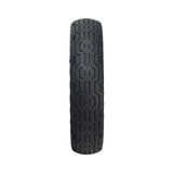 8.5x 2 Solid Honeycomb Tire for the Xiaomi Mi M365, featuring a patterned tread and open holes around the radius for shock absorption, designed for flat-free riding on electric scooters.