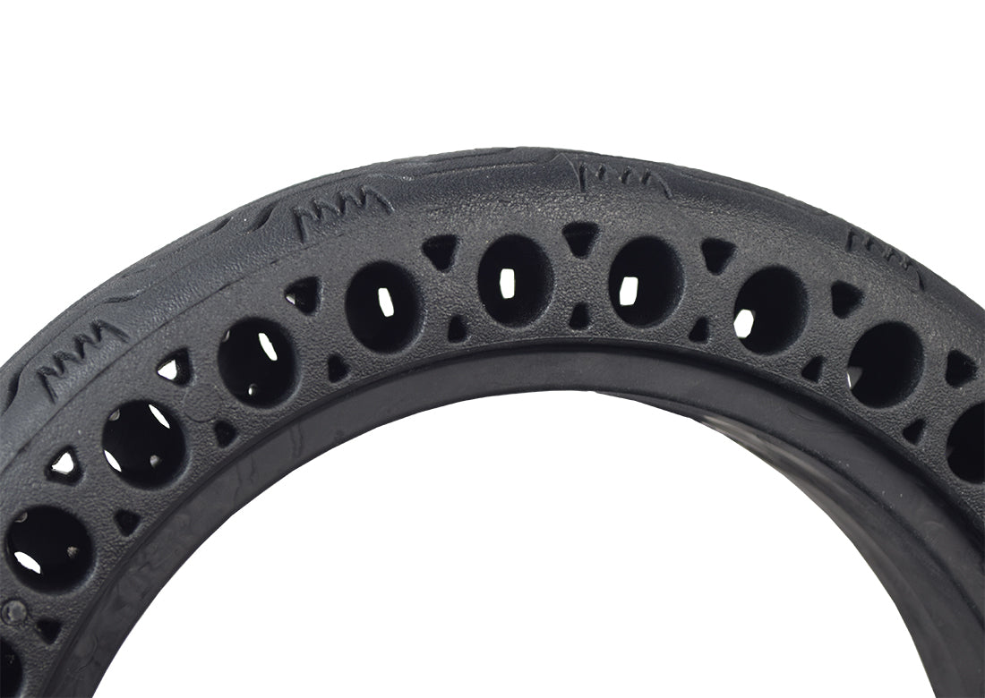 8.5x 2 Solid Honeycomb Tire for the Hover-1 Journey Folding Electric Scooter, featuring visible open holes around the radius for shock absorption, shown in a close-up view highlighting its flat-free design.