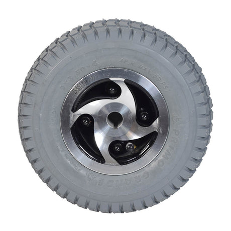 9x3.50-4 Pneumatic Rear Wheel Assembly for the Rascal 240, featuring a metal rim and aggressive C203 tread pattern on a Primo Grande Knobby tire, ideal for enhanced gripping power.