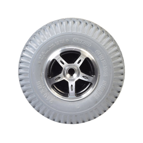 3.00-4 (10x3, 260x85) Flat-Free Rear Wheel Assembly for the Merits Regal (P310) Power Chair, featuring a silver rim and solid tire with floor-gripping tread, designed for dependable performance.