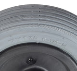 Front Caster Wheel Assembly for Rascal 320 power chair, showing a close-up of the foam-filled ribbed tread, black hub, and visible bearings, ensuring flat-free dependability.