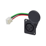 Female Charging Port Assembly for Merits Pioneer Series Scooters, featuring a black and green plug with attached white and red wires, designed for offboard battery charging.