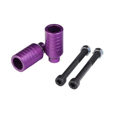 Kick Scooter Stunt Pegs & Axle Bolts (Set of 2) featuring a purple cylindrical design with black bolts and nuts. Suitable for enhancing trick performance on pro or freestyle kick scooters.