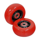 Set of two 76 mm x 30 mm caster wheels for Razor Crazy Cart models, showcasing red wheels with a black rim in a close-up view, highlighting their wider, flatter tire design.