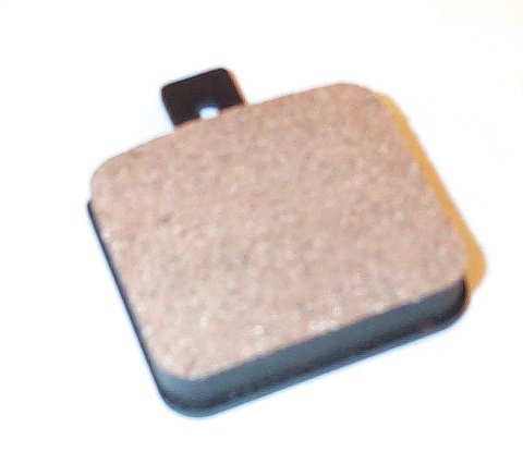 Close-up of a Metal Brake Pad for Arctic Cat Snowmobiles (1993-2008), featuring a small square design suitable for snowmobile braking systems, highlighting its durable, lightweight construction.