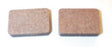 Metal Brake Pads for Arctic Cat Snowmobiles (1971-1981); close-up of two brown, rectangular-shaped brake pads with a textured surface.