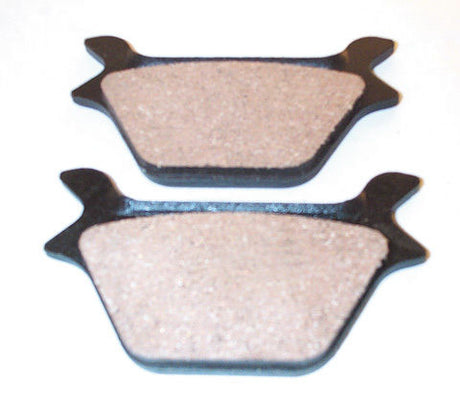 Metal Brake Pads for Polaris Snowmobiles (1993-1998), shown as a pair of rectangular, textured brake pads, designed for dependable performance and resistance to extreme temperatures, shock, and vibration.