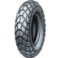 Close-up of the Michelin 130/90-10 Reggae Scooter Tire, showcasing its distinctive knobby tread pattern designed for superior grip on varied terrains. Ideal for both on- and off-road scooter use.