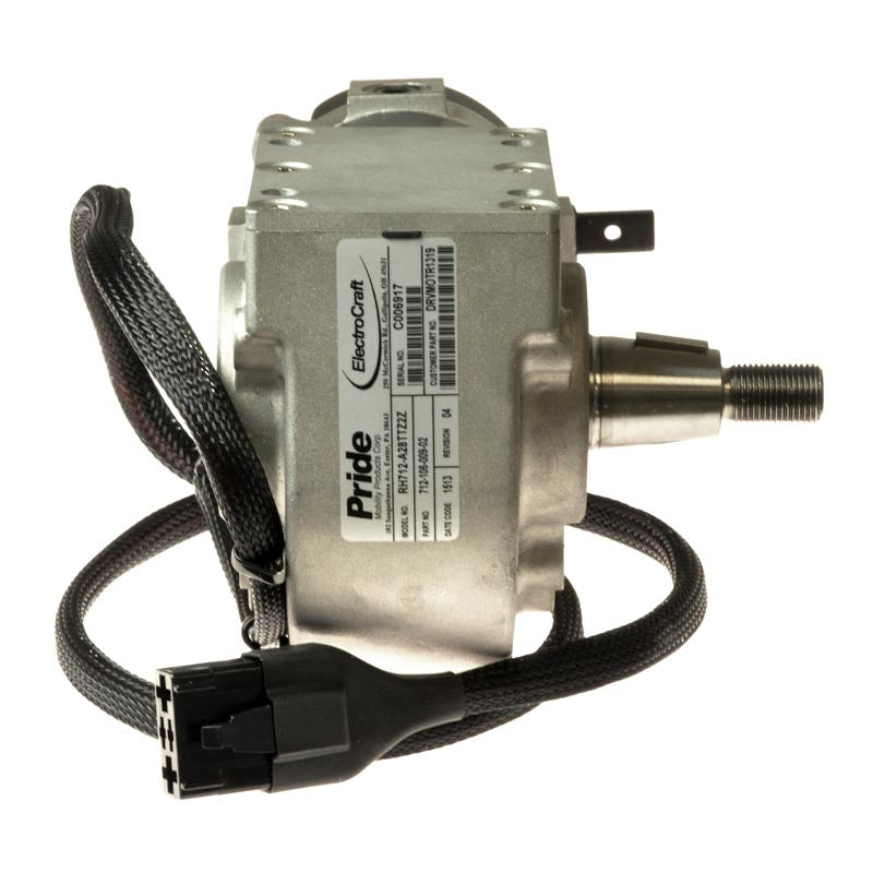 Left Motor Assembly (ES712106009-02) for Quantum Q6000Z & Q6000Z HD Power Chairs. Features a silver electric motor with a black cord, close-up of the label and metal components.