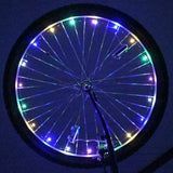 LED Bicycle Rim Spoke String Lights on a bicycle wheel, showcasing colorful, illuminated patterns for enhanced low-light visibility and style.