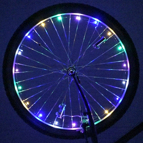 LED Bicycle Rim Spoke String Lights on a bicycle wheel, showcasing colorful, illuminated patterns for enhanced low-light visibility and style.