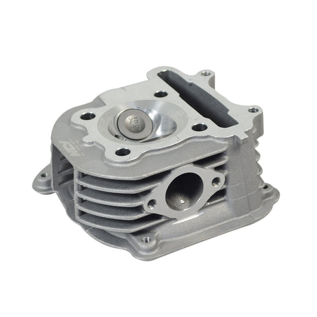 Big Valve Cylinder Head for 150cc GY6 Engines by NCY, featuring a silver metal part with a large round hole for improved air intake and performance.