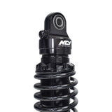 Rear Shocks for the Yamaha Zuma 125 featuring a black coil with a round lens and white text, designed for high performance and durability, sold as a pair.