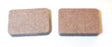 Close-up of Organic Brake Pads for Arctic Cat Snowmobiles (1978-1991), showcasing a pair of cork squares essential for reliable, lightweight performance in extreme temperatures and resistance to shock and vibration.