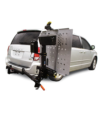 Swing Away Arm Hitch Assembly for Pride Outlander Vehicle Lifts attached to a van, showcasing the lift's pivot mechanism, larger handle, and streamlined design for enhanced usability and durability.