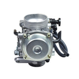 PD32J Carburetor for the Honda ATC250, TRX300, TRX350, & TRX400 FourTrax ATVs, featuring a close-up of its silver engine components with black electrical cables and intricate metal parts.