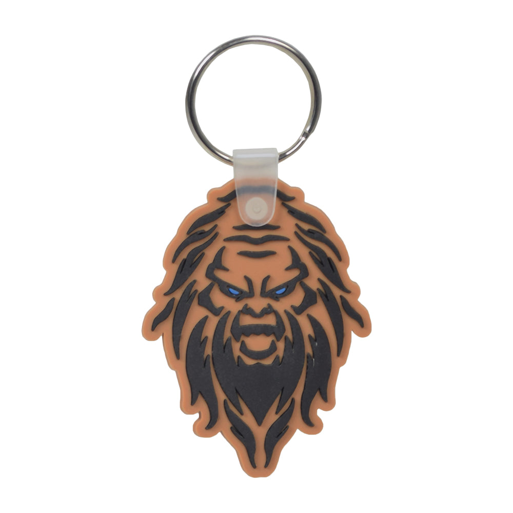 Monster Scooter Parts Sasquatch Keychain features a playful face on soft PVC, perfect for holding scooter, ATV, or go-kart keys, and includes contact details on the back.