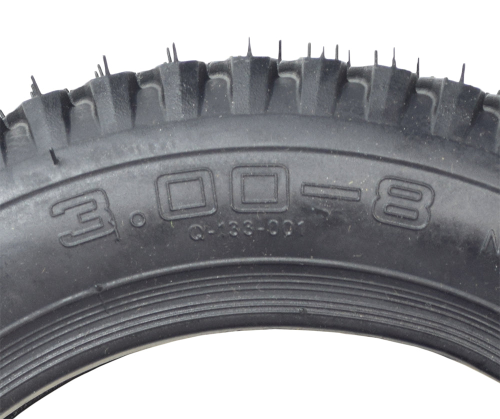 Close-up of a 14x3 (3.00-8) Black Pneumatic Mobility Tire with Q133 Tread, showcasing its detailed tread pattern and robust construction, designed for Pride Pursuit XL (SC714) mobility scooters.