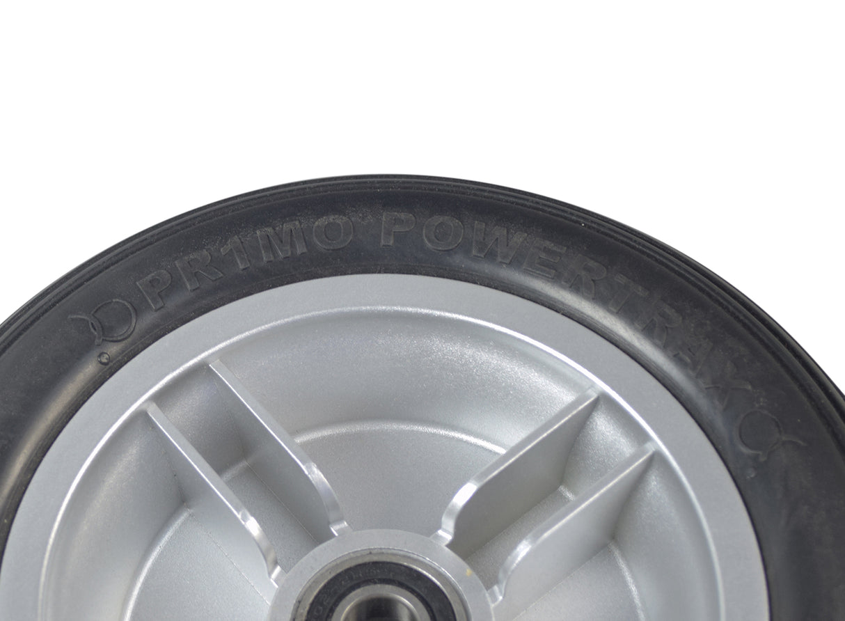 Black Foam Filled Front Wheel Assembly for the 4-Wheel Pride Revo (SC64) displaying a close-up of the tire with visible tread and metal rim, highlighting its sturdy construction for dependable mobility.