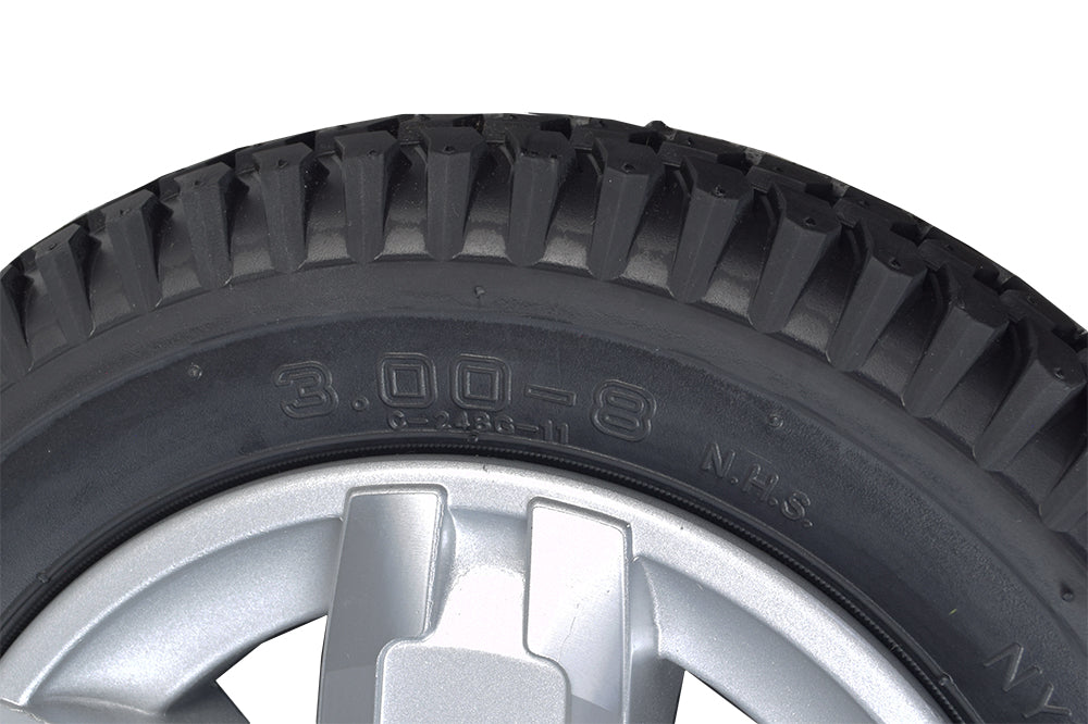 Close-up of the 14x3 Run Flat Drive Wheel for the Jazzy 600 ES power chair, featuring its black tire with anti-flat composition and 5-spike silver finished hub.