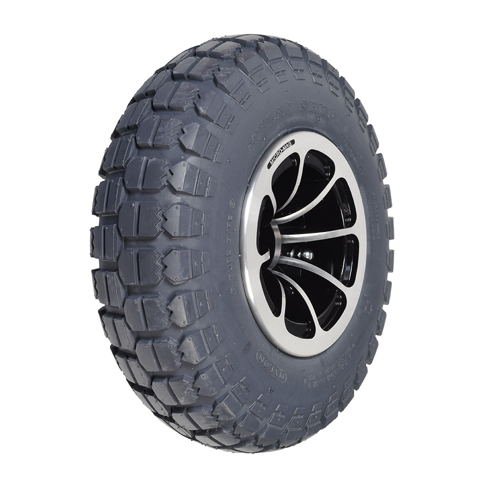 14x4 Flat-Free Drive Wheel Assembly for Jazzy 1450 & Quantum Q1450, featuring a silver, 2-piece split rim and knobby tread tire, shown in a close-up view.