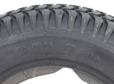 Close-up of a 14x3 flat-free black tire with C-248 Powertrax tread for the Quantum Q6 Edge 2.0 & Q6 Edge 2.0 X, featuring a knobby pattern for durability.