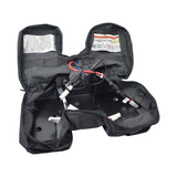 Battery Bag & Harness Assembly without Batteries for the Pride Travel Pro, featuring visible wires, a zipper, and a warning sign, designed for lightweight and dirt-resistant battery storage.